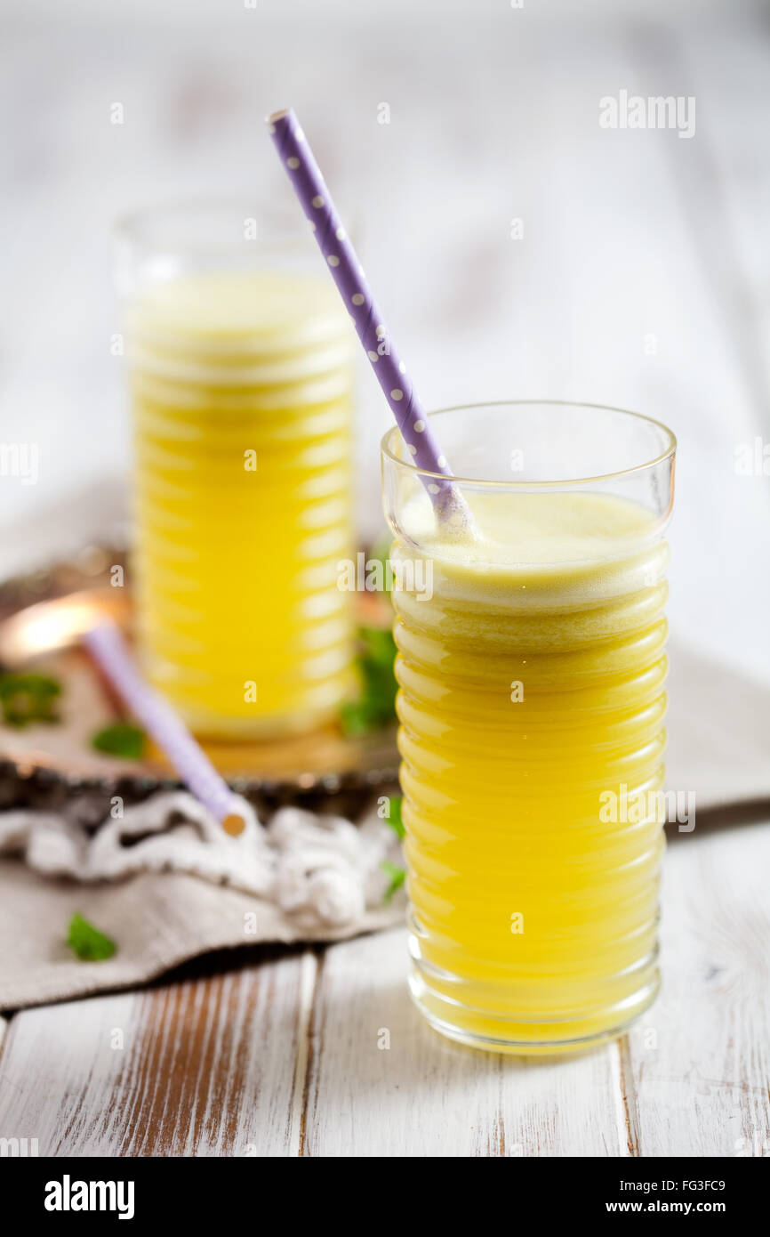 Juice from fresh pineapple, apple and lemon Stock Photo Alamy