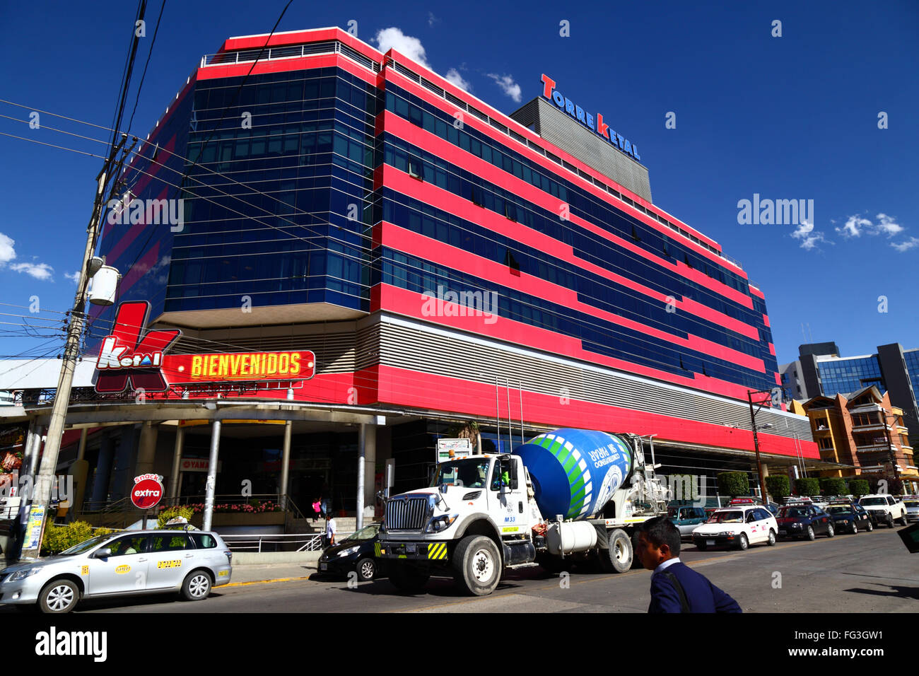 Concrete mixing truck in front of Ketal Tower, Calacoto, Zona Sur, La Paz, Bolivia Stock Photo