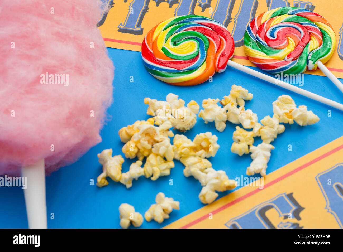Lollipops, cotton candy and popcorn on table Stock Photo