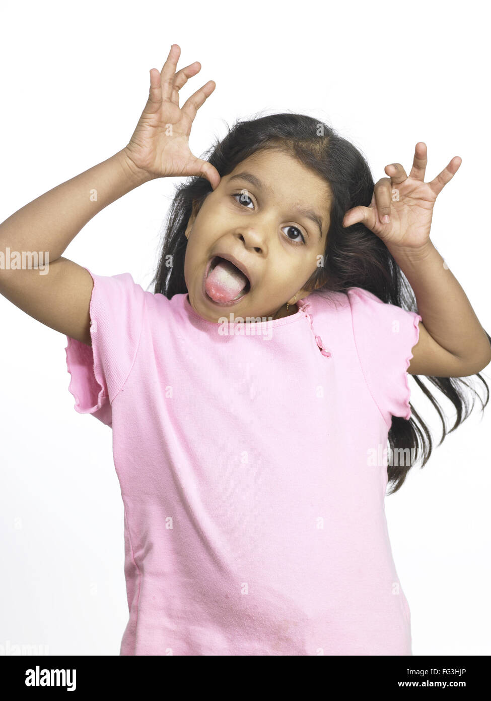South Asian Indian girl making funny face in nursery school MR Stock Photo  - Alamy