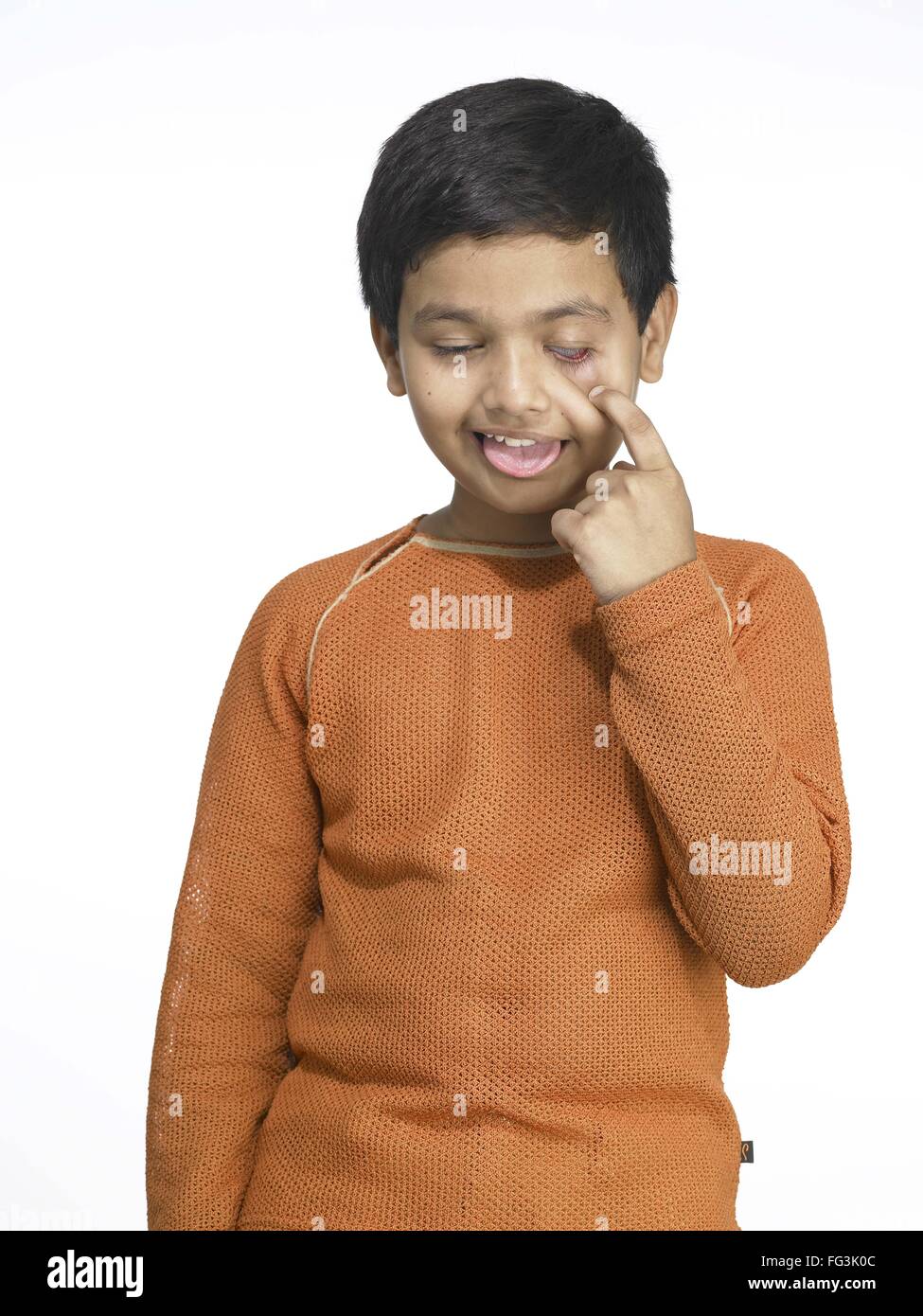 South Asian Indian boy making funny face in nursery school MR Stock ...