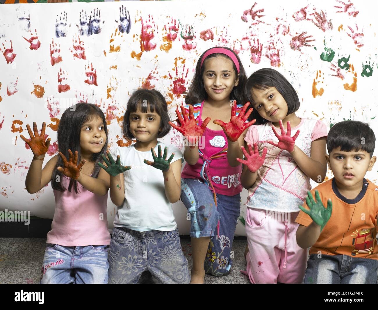 Indian Child Color Hand South Asian Indian boy and girls showing hand palms covered with paint ...