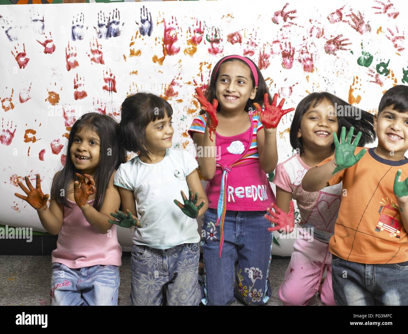 Indian Child Color Hand South Asian Indian boy and girls showing hand palms covered with paint ...