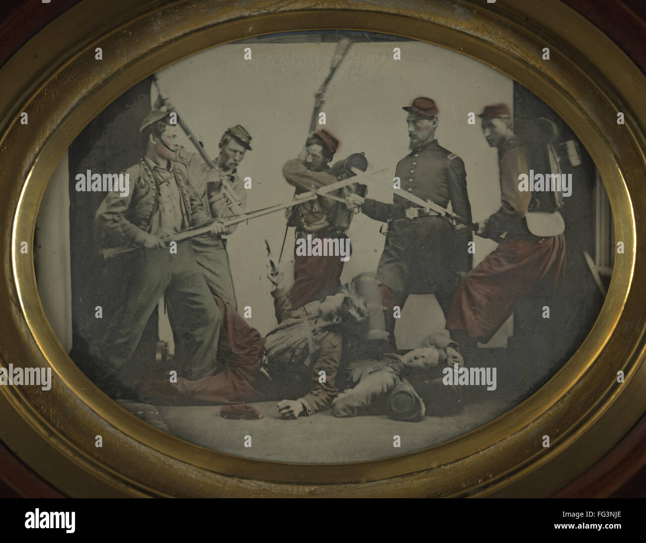 CIVIL WAR REENACTMENT. /nMen in Union Army uniforms reenacting a battle scene. Handcolored