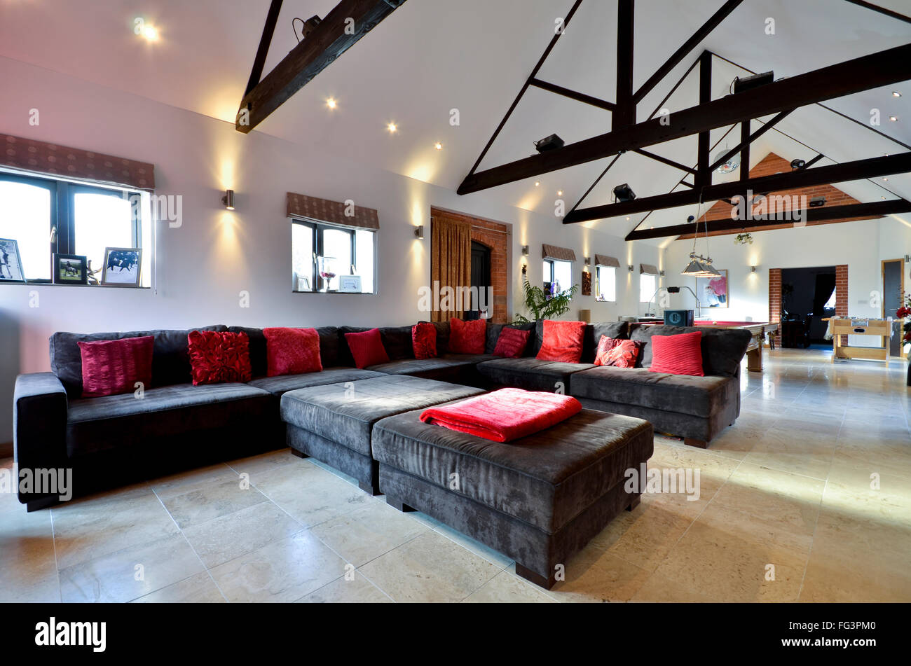 Large corner sofa in luxury home games room Stock Photo