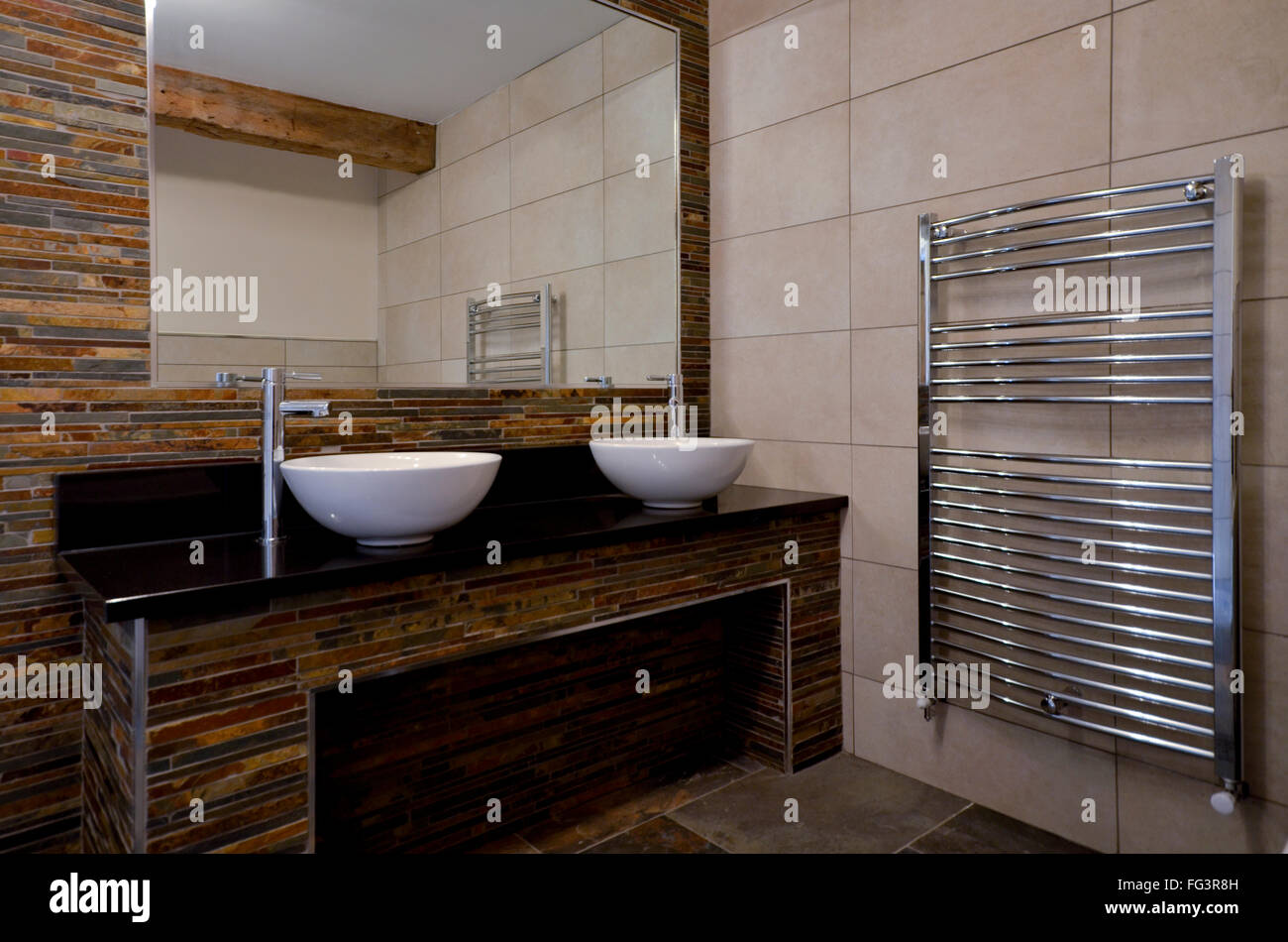 Family cloakroom with towel rail and double bowls Stock Photo Alamy