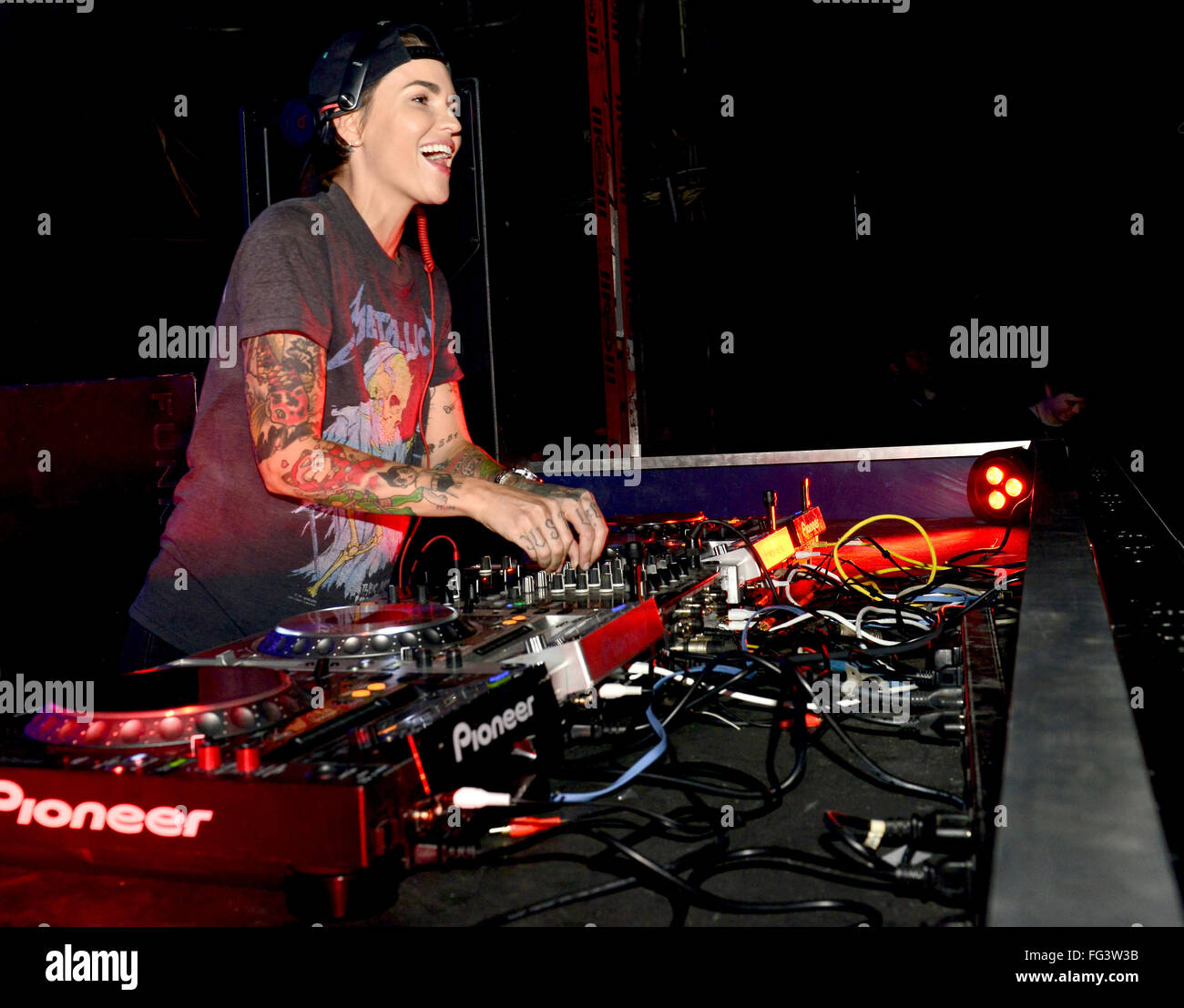 Ruby Rose shows off her array of tattoos in a Metallica t-shirt as she ...