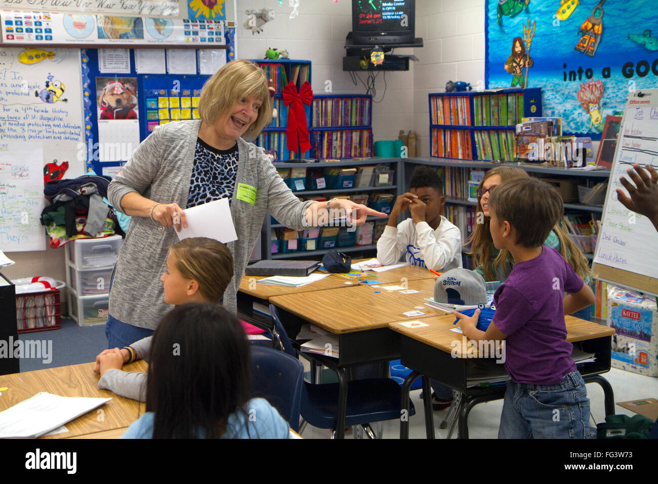 Teacher in fourth grade classroom with students, USA. Stock Photo