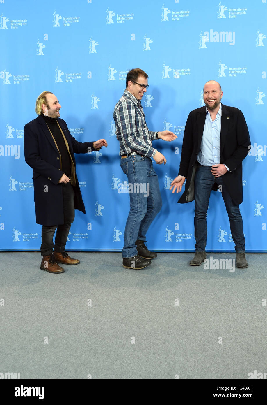 Berlin, Germany. 17th Feb, 2016. 66th International Film Festival in Berlin, Germany, 17 February 2016. Photo call 'Des nouvelles de la planete Mars' ('News from planet Mars': Director Dominik Moll (C) and actors Vincent Macaigne (L) and Francois Damiens. The film is shown in the Berlinale Competition (Out of Competition). The Berlinale runs from 11 February to 21 February 2016. Photo: Jens Kalaene/dpa/Alamy Live News Stock Photo