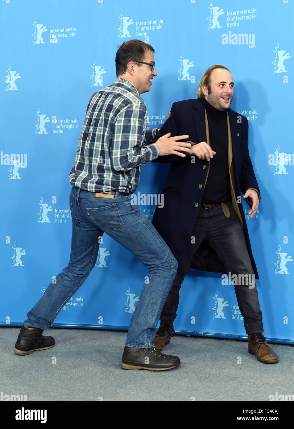 Berlin, Germany. 17th Feb, 2016. 66th International Film Festival in Berlin, Germany, 17 February 2016. Photo call 'Des nouvelles de la planete Mars' ('News from planet Mars': Director Dominik Moll (L-R) and actor Vincent Macaigne. The film is shown in the Berlinale Competition (Out of Competition). The Berlinale runs from 11 February to 21 February 2016. Photo: Jens Kalaene/dpa/Alamy Live News Stock Photo