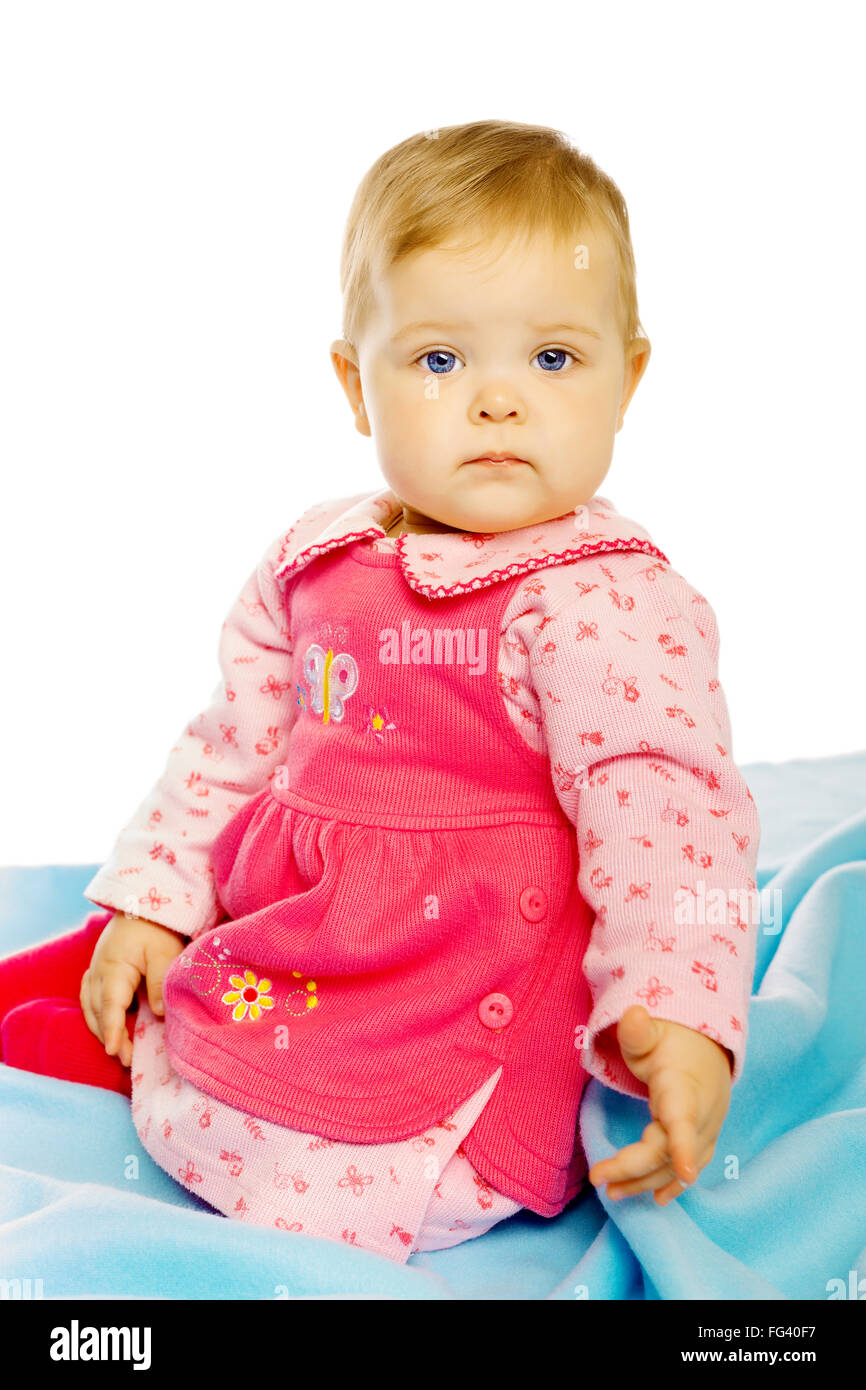 Little girl baby in a dress sitting on the floor Stock Photo - Alamy