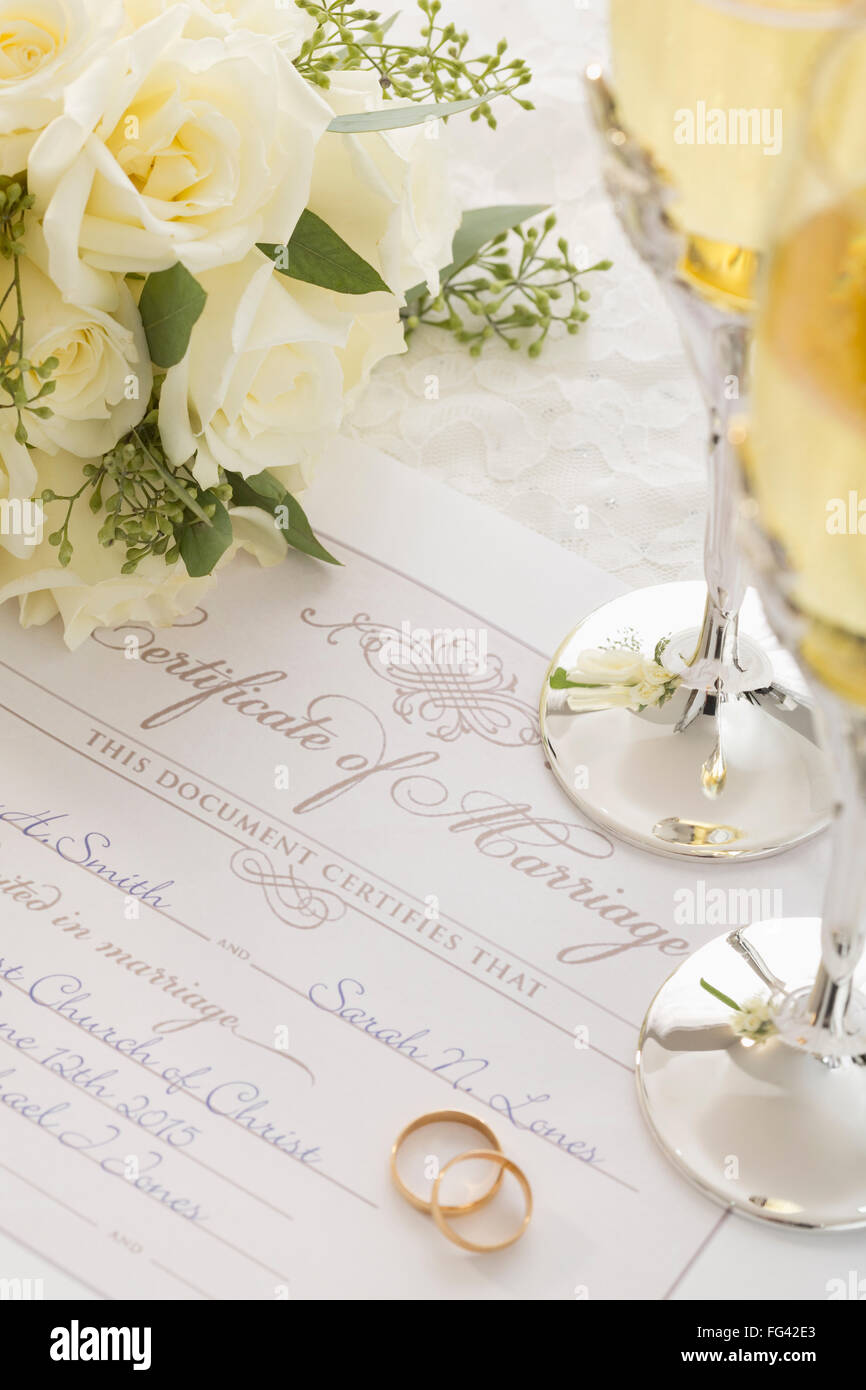 Wedding rings on marriage certificate Stock Photo