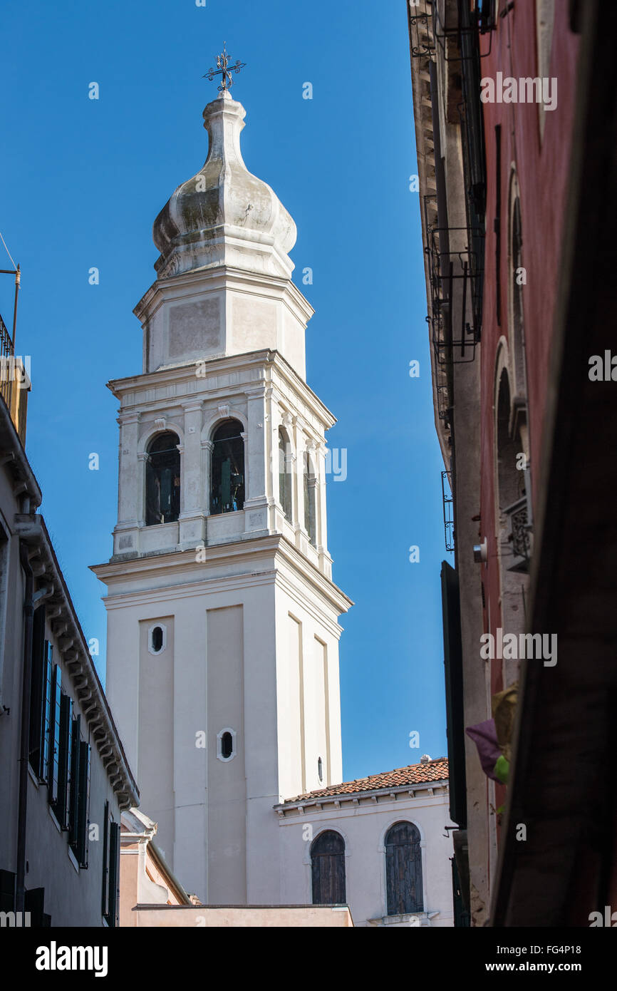 Various towers and steeples in the city of Venice with blue sky and a few clouds in the sky Stock Photo