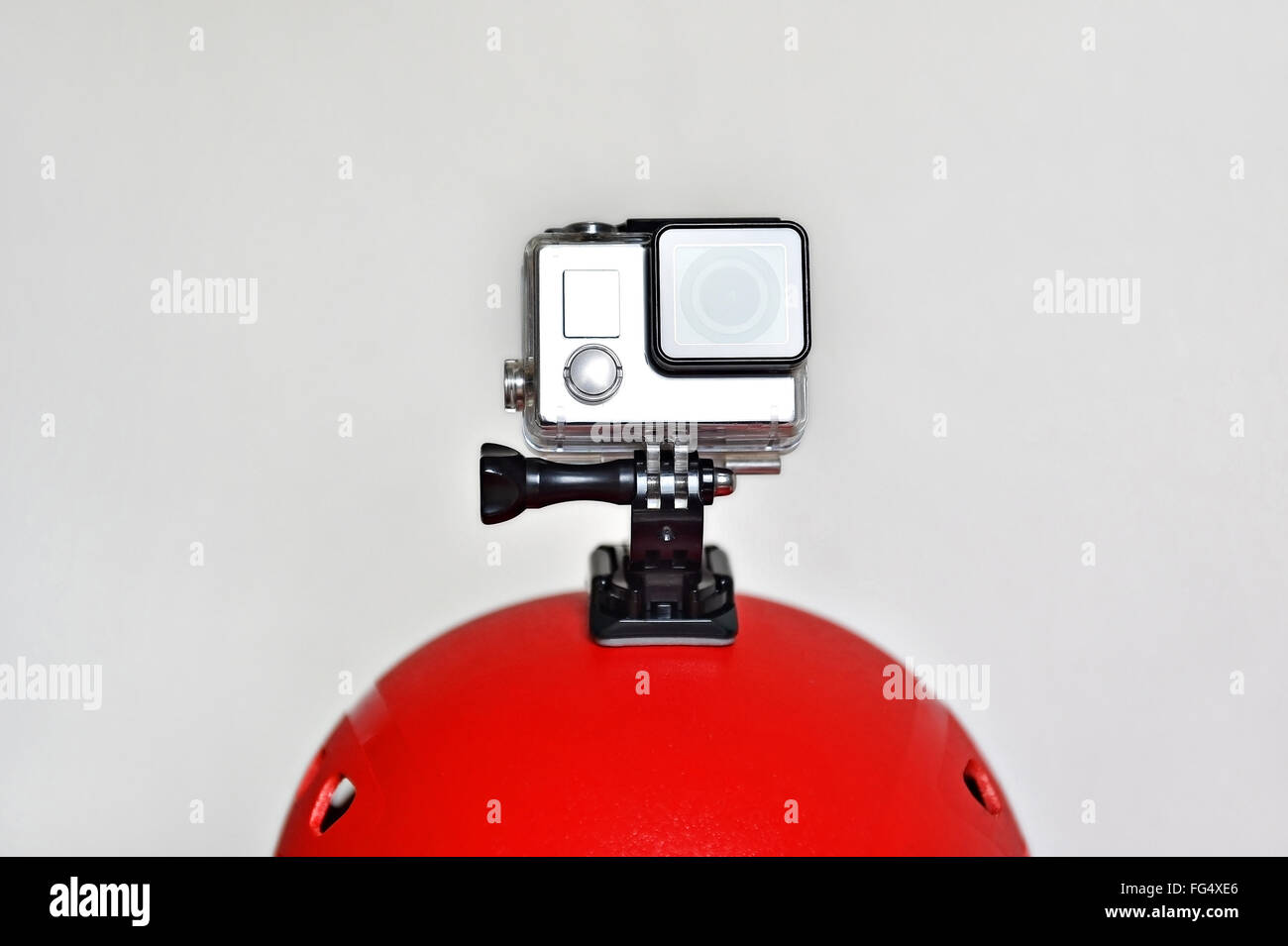 Detail shot with action camera mounted on a red sports helmet Stock Photo
