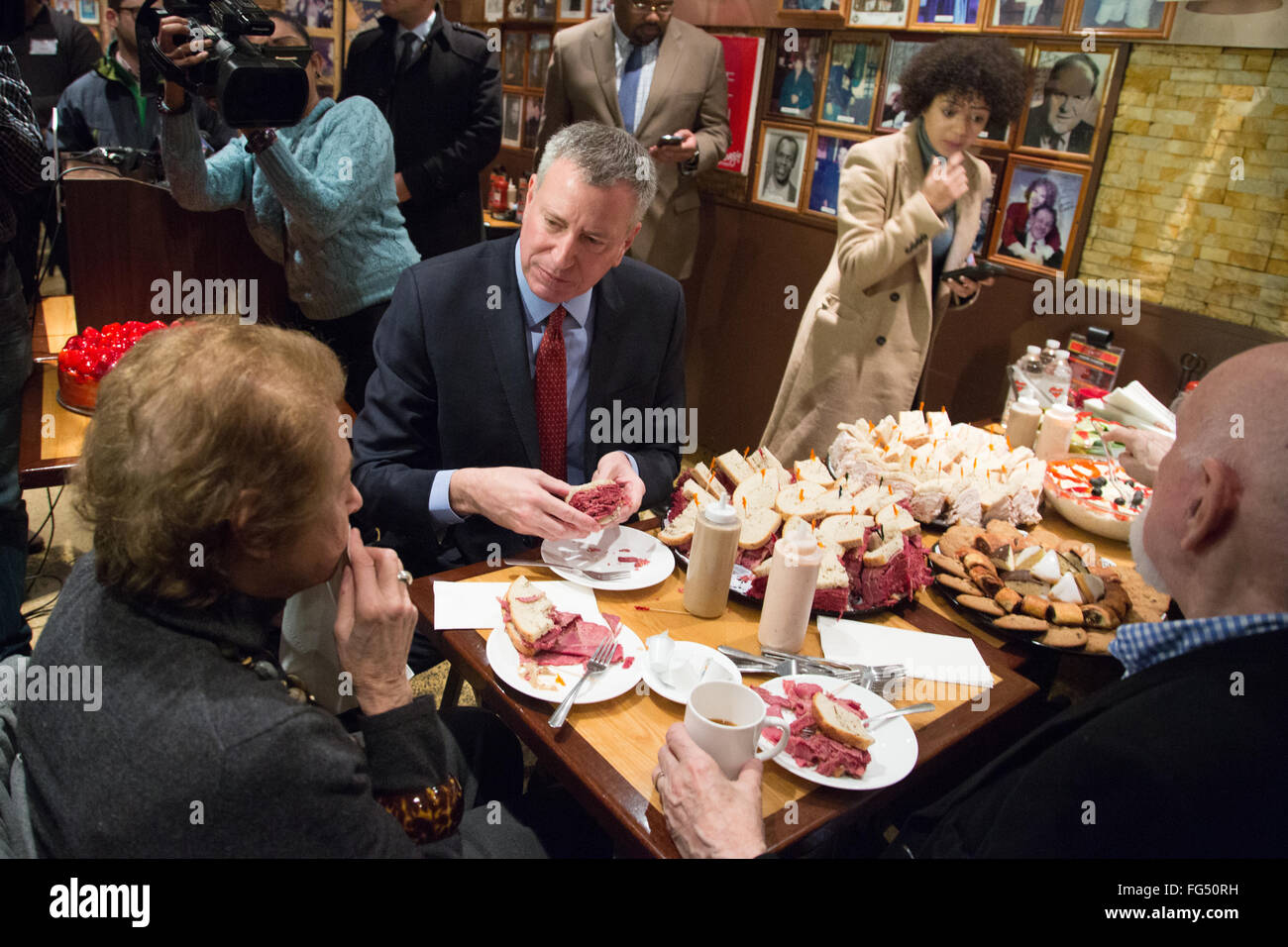 New York City, United States. 17th Feb, 2016. Actor Dominic Chianese & Food Critic Mimi Sheraton join Mayor de Blasio to attend the grand re-opening of New York City's iconic Carnegie Deli Credit:  Louise Wateridge/Pacific Press/Alamy Live News Stock Photo