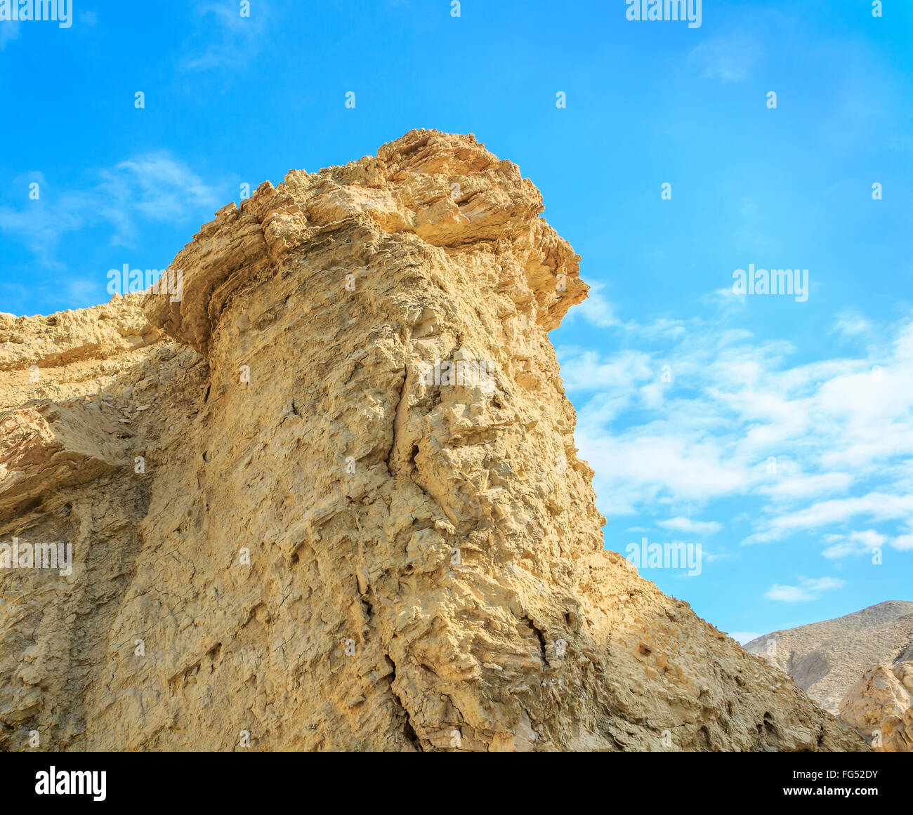 Cretaceous rocks of the Judean Desert on a background of blue sky Stock Photo