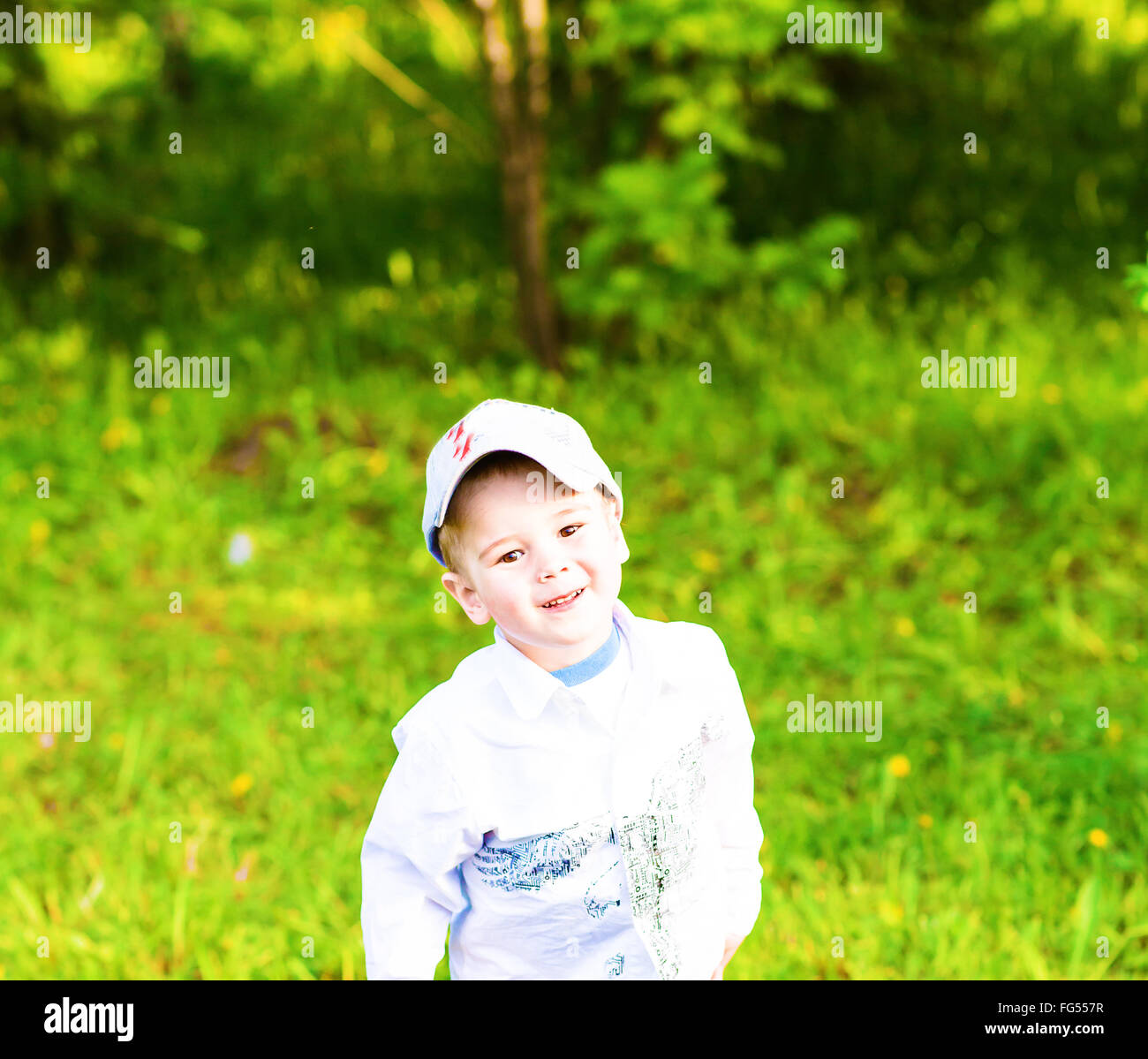 Portrait of a happy little boy in the park Stock Photo - Alamy