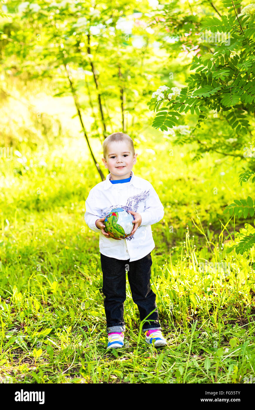 Portrait of a happy little boy in the park Stock Photo - Alamy