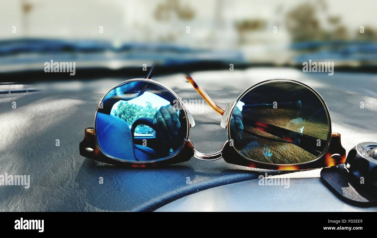 CloseUp Of Reflection On Sunglasses At Car Dashboard Stock Photo Alamy