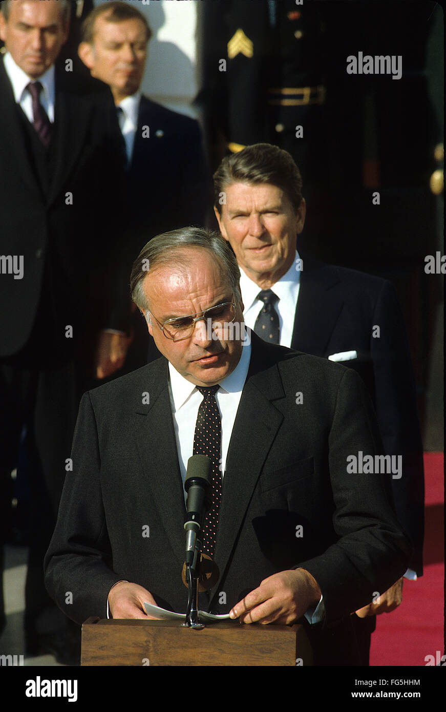 Washington, DC., USA, 15th November, 1988 Helmut Kolh  Chancellor of West Germany delivers departing remarks at the conclusion of his Official State visit to the White House. President Ronald Reagan is standing behind him at the podium at the South Diplomatic entrance to the White House.  Helmut Josef Michael Kohl  is a German conservative politician and statesman. He served as Chancellor of Germany from 1982 to 1998 (of West Germany 1982–90 and of the reunited Germany 1990–98) and as the chairman of the Christian Democratic Union (CDU) from 1973 to 1998. Credit: Mark Reinstein Stock Photo