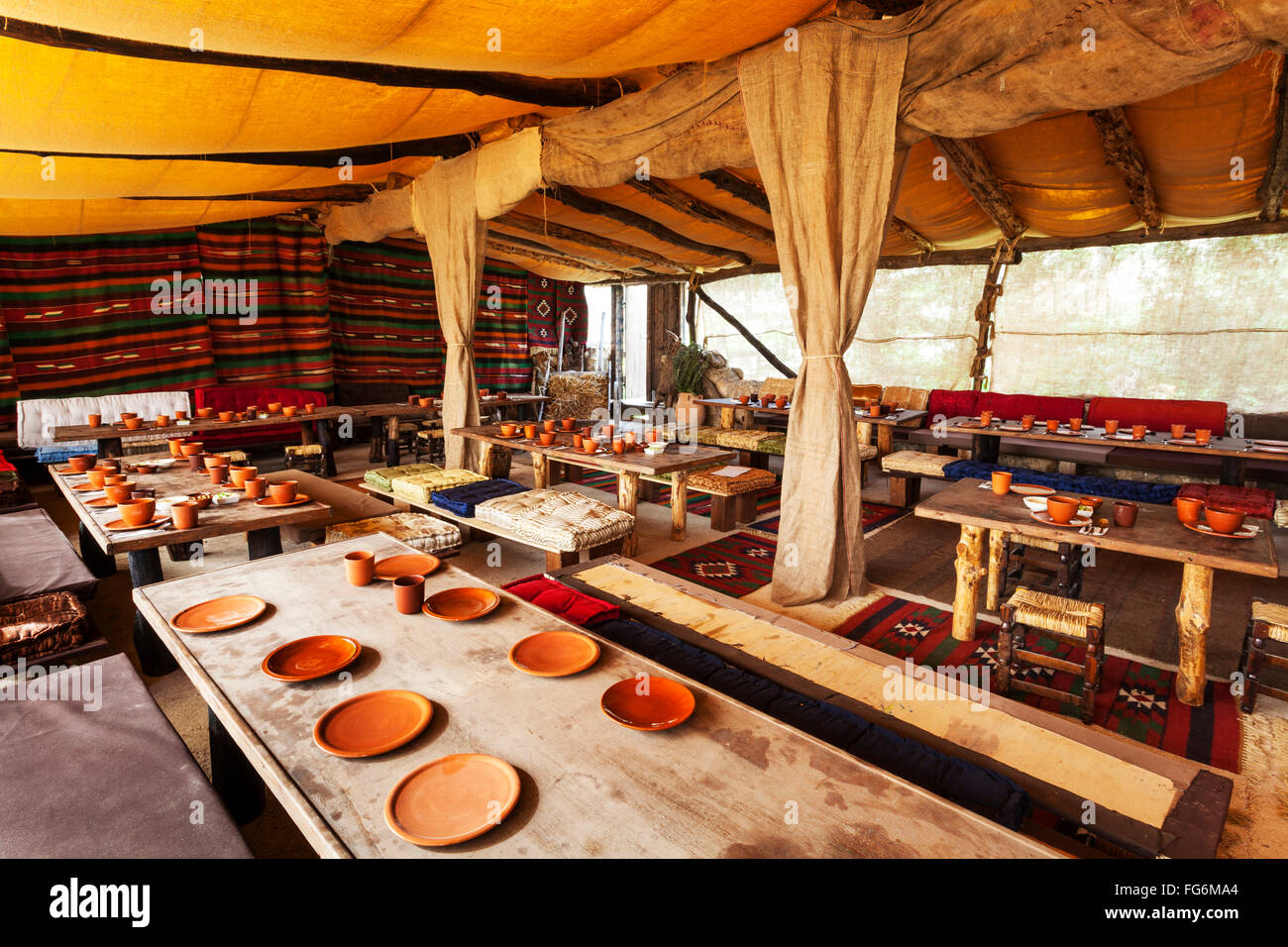 Dining hall with set tables; Nazareth, Israel Stock Photo