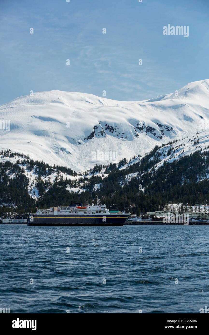 An AK Marine Highway ferry arrives at the Whittier harbor in the winter, Prince William Sound, Southcentral AK, USA, Winter Stock Photo