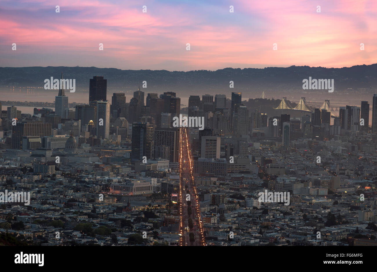 Downtown San Francisco with Market Street clearly illuminated at dawn, as seen from Twin Peaks, California, USA Stock Photo