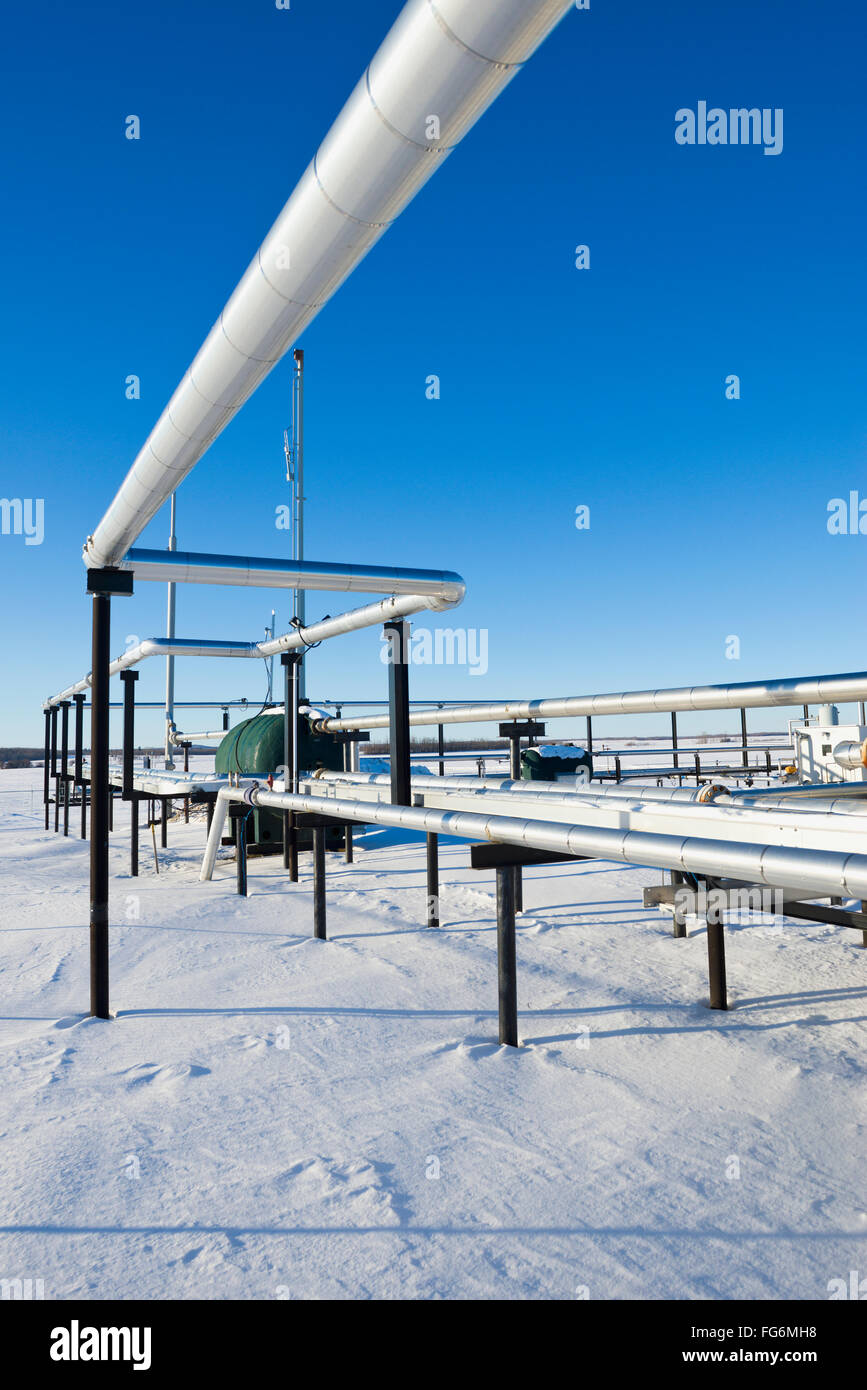 Gas pipelines in the winter snow; Morinville, Alberta, Canada Stock