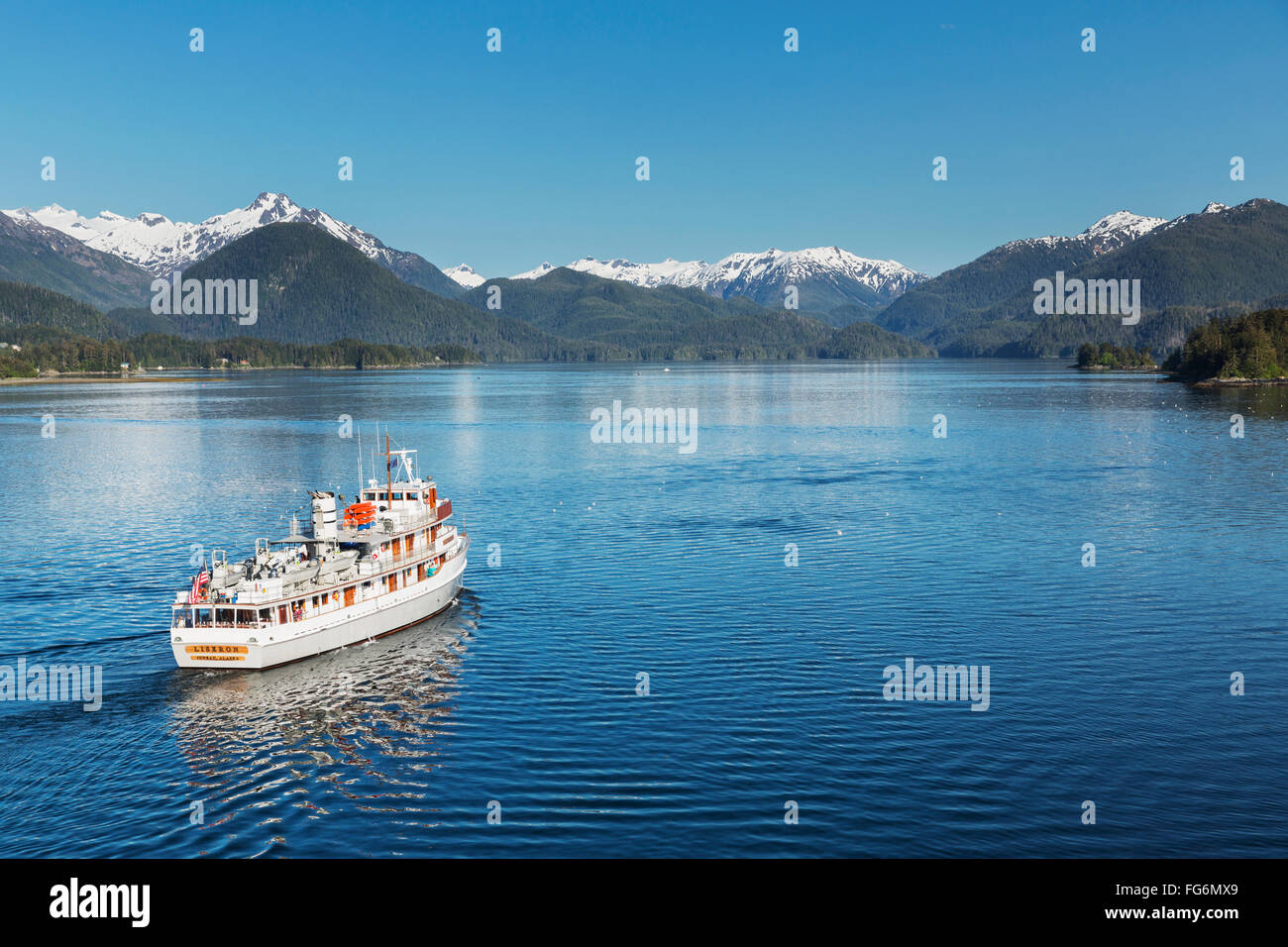 A passenger ship sails out of the Sitka Harbor, Sitka, Southeast Alaska, USA, Summer Stock Photo