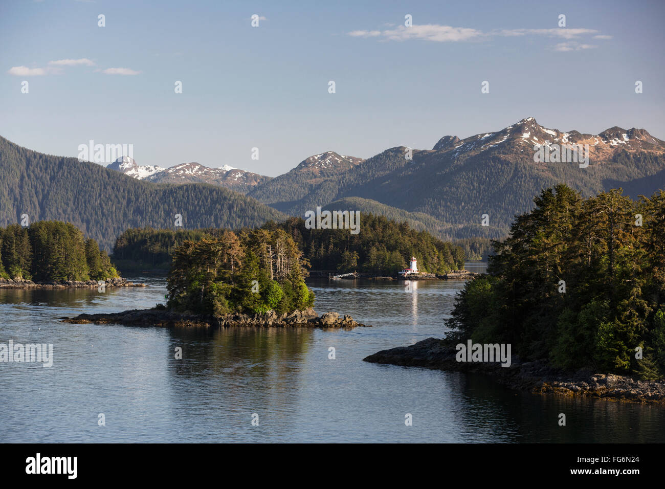 Small islands populated by Sitka spruce trees, a lighthouse in the ...