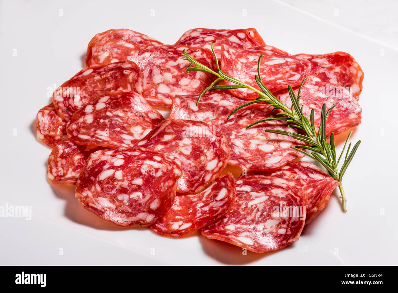 Italian salami with pepper, milan, bratwurst, finely chopped, rosemary, meat, pork, spicy, aroma, spice, tasty, expensive, exclu Stock Photo