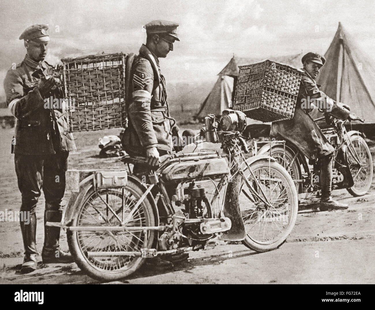 WWI: CARRIER PIGEONS. /nBritish motorcyclists taking carrier pigeons to front line trenches during World War I. Photograph, c1916. Stock Photo