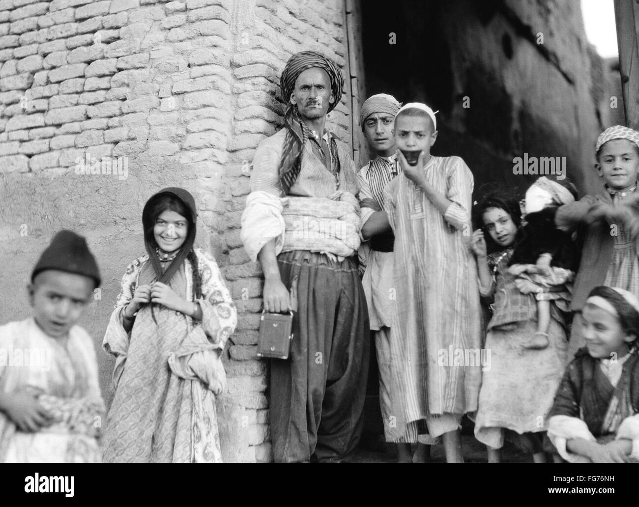 IRAQ: ARBELA, 1932. /nA man and children in Arbela (now Erbil), Iraq ...