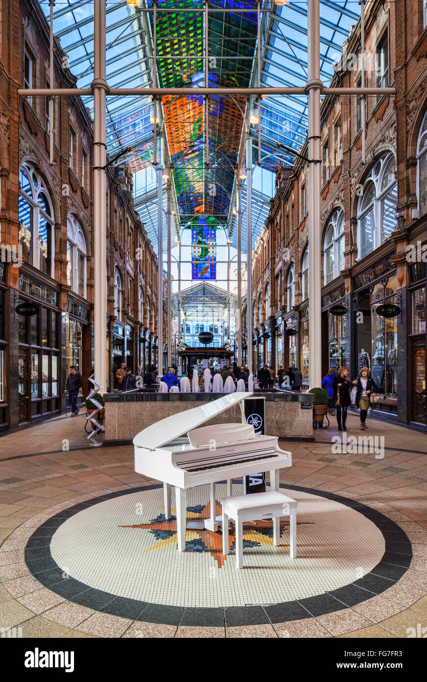 Yamaha baby grand piano in the County Arcade, Victoria Quarter, Leeds,West Yorkshire, England, UK Stock Photo