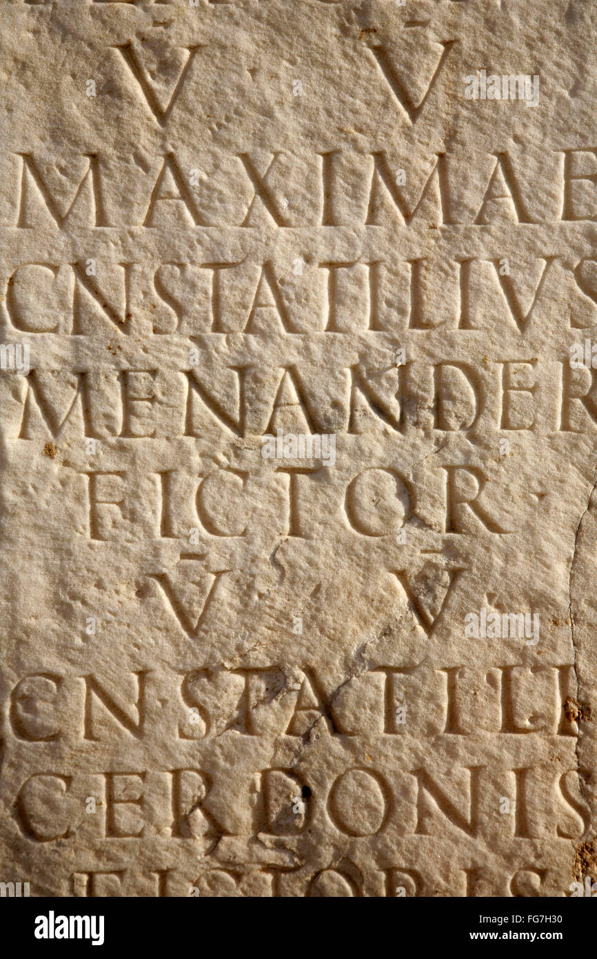 Latin inscription carved into stone tablet Stock Photo Alamy