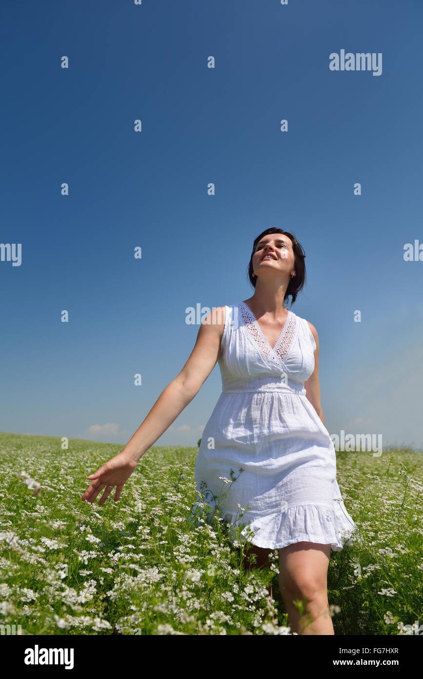 Young happy woman in green field Stock Photo - Alamy