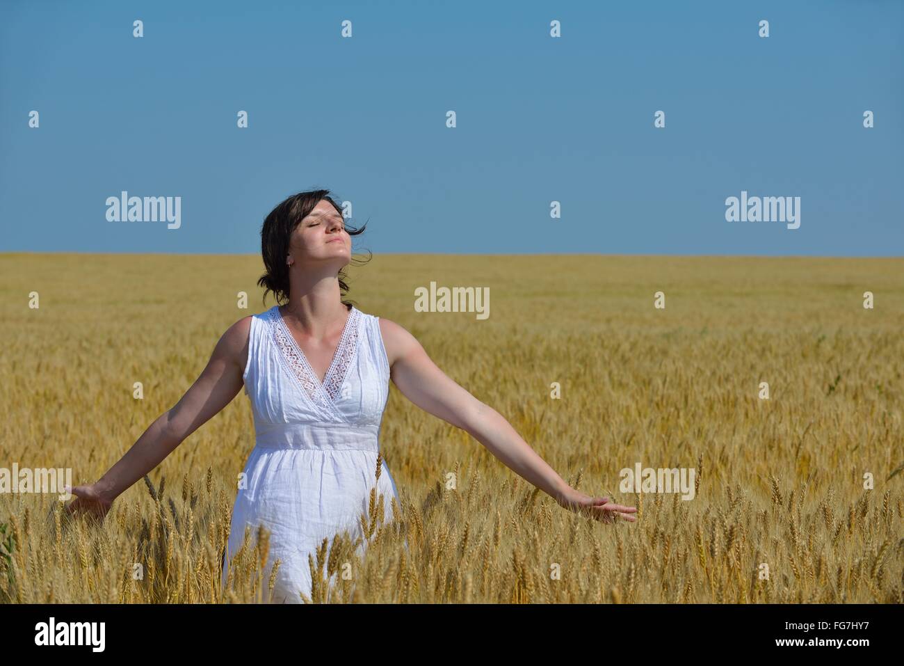 young woman in wheat field at summer Stock Photo - Alamy