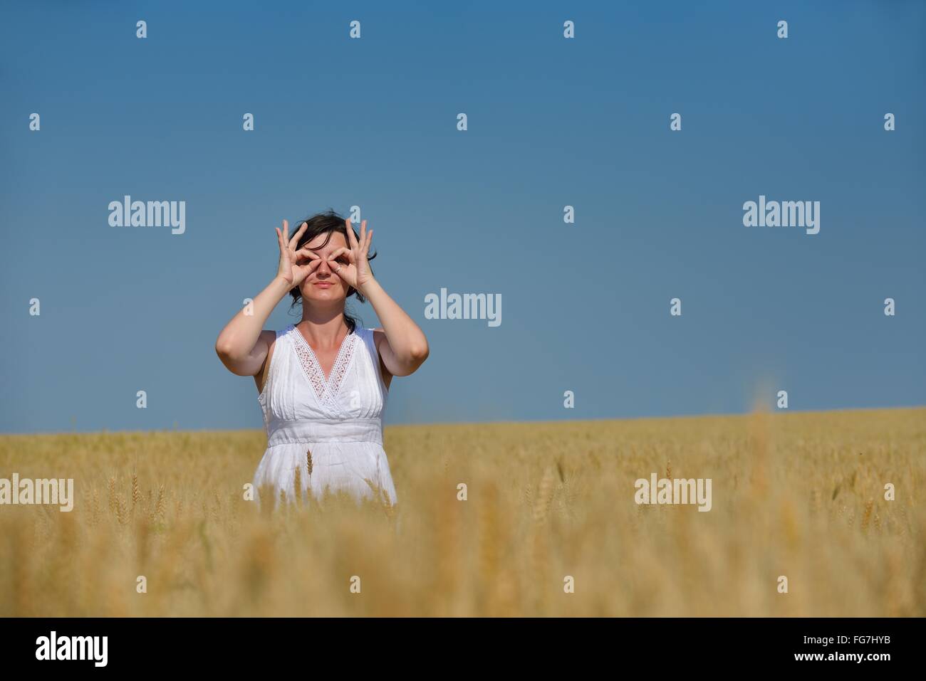 young woman in wheat field at summer Stock Photo - Alamy