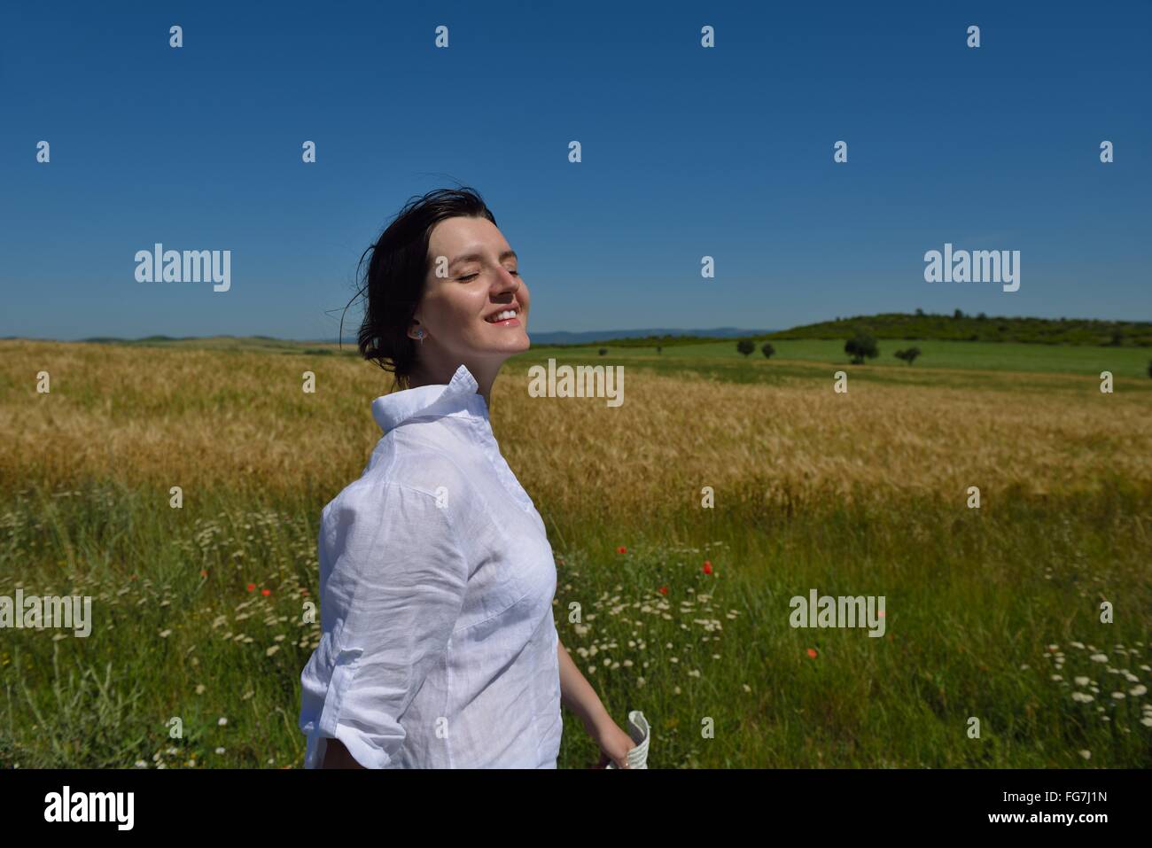 young woman in wheat field at summer Stock Photo - Alamy