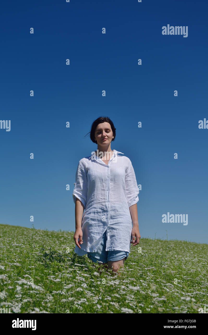 Young happy woman in green field Stock Photo - Alamy