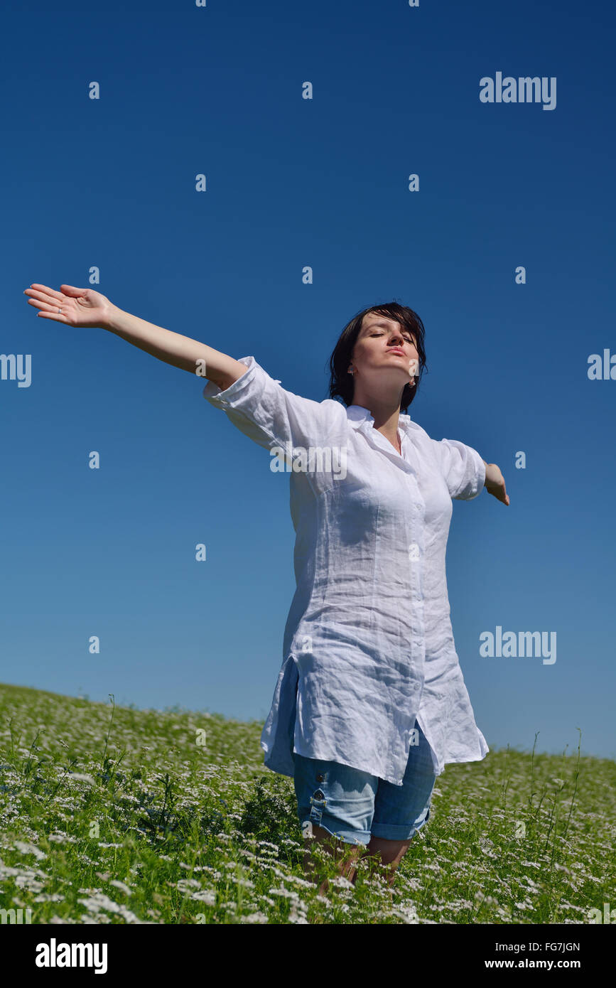 Young happy woman in green field Stock Photo - Alamy
