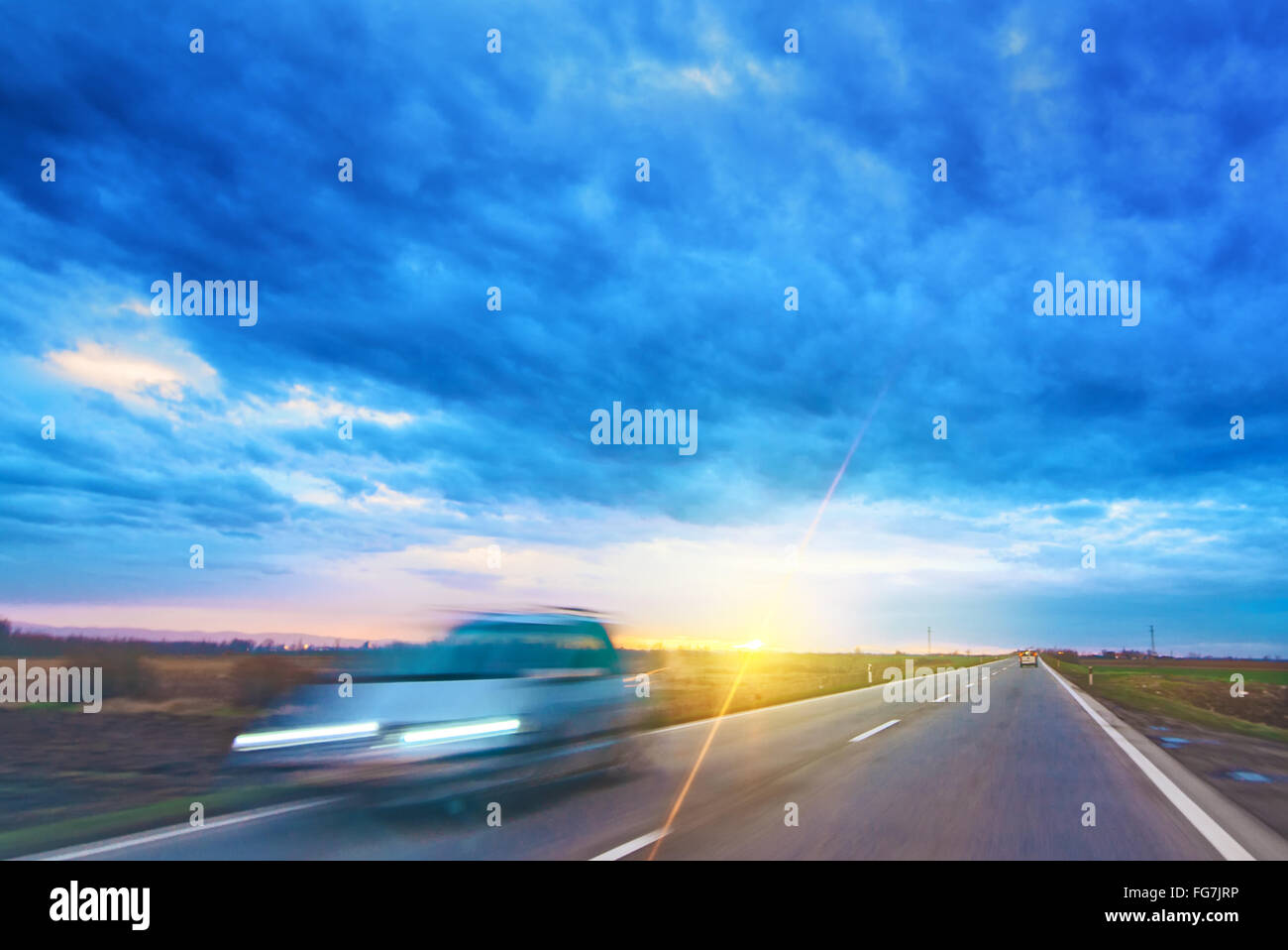 Drive plate, driving shot, driving car through along countryside lane, view through vehicle front windshield window Stock Photo