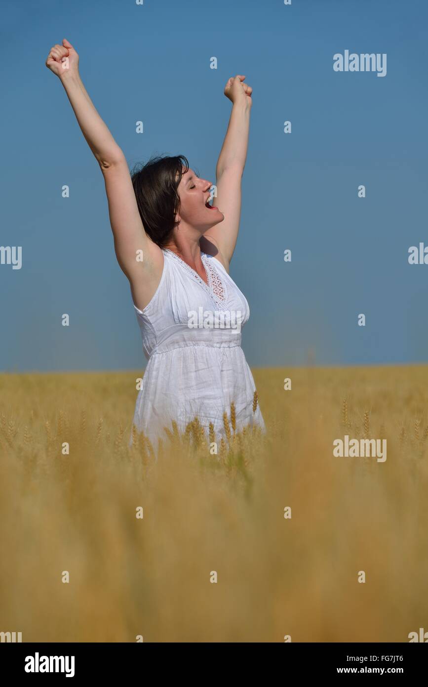 young woman in wheat field at summer Stock Photo - Alamy