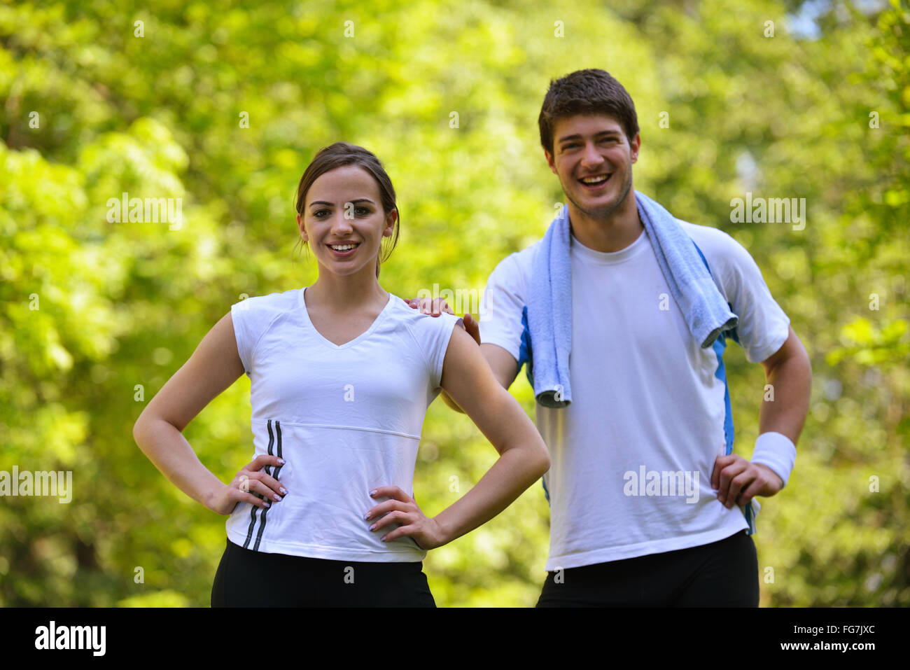 Couple doing stretching exercise  after jogging Stock Photo