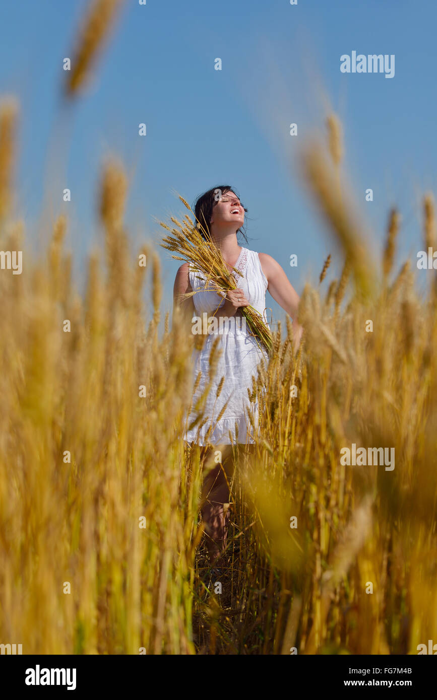 young woman in wheat field at summer Stock Photo - Alamy