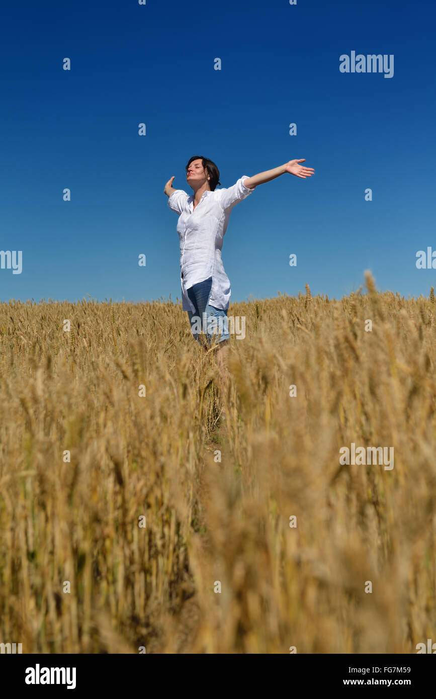 young woman in wheat field at summer Stock Photo - Alamy