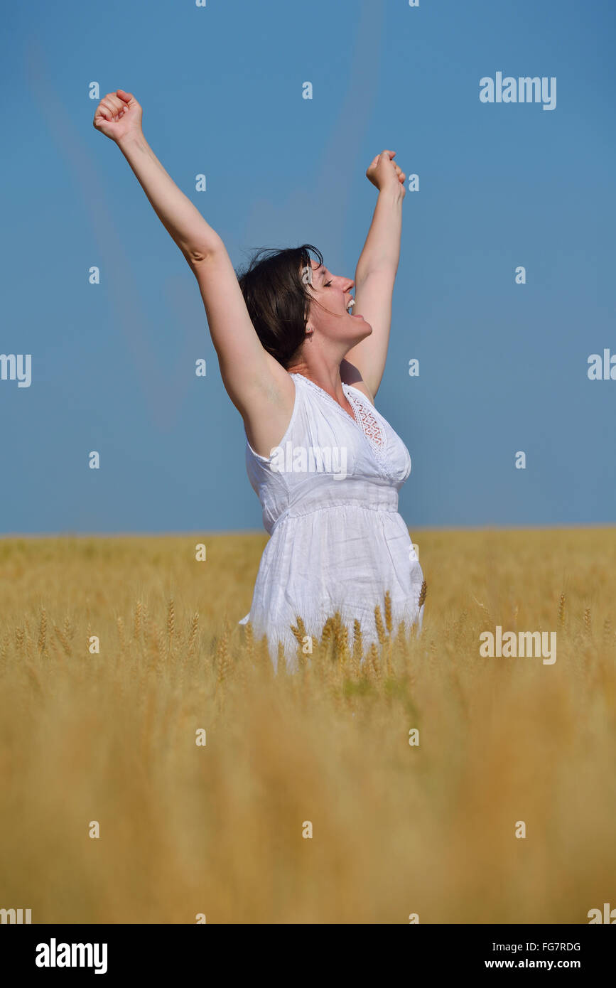 young woman in wheat field at summer Stock Photo - Alamy
