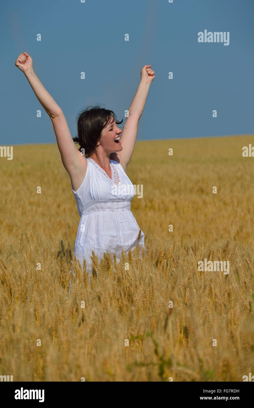 young woman in wheat field at summer Stock Photo - Alamy