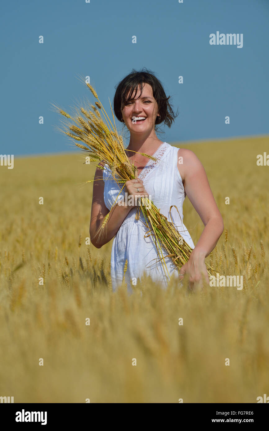 young woman in wheat field at summer Stock Photo - Alamy