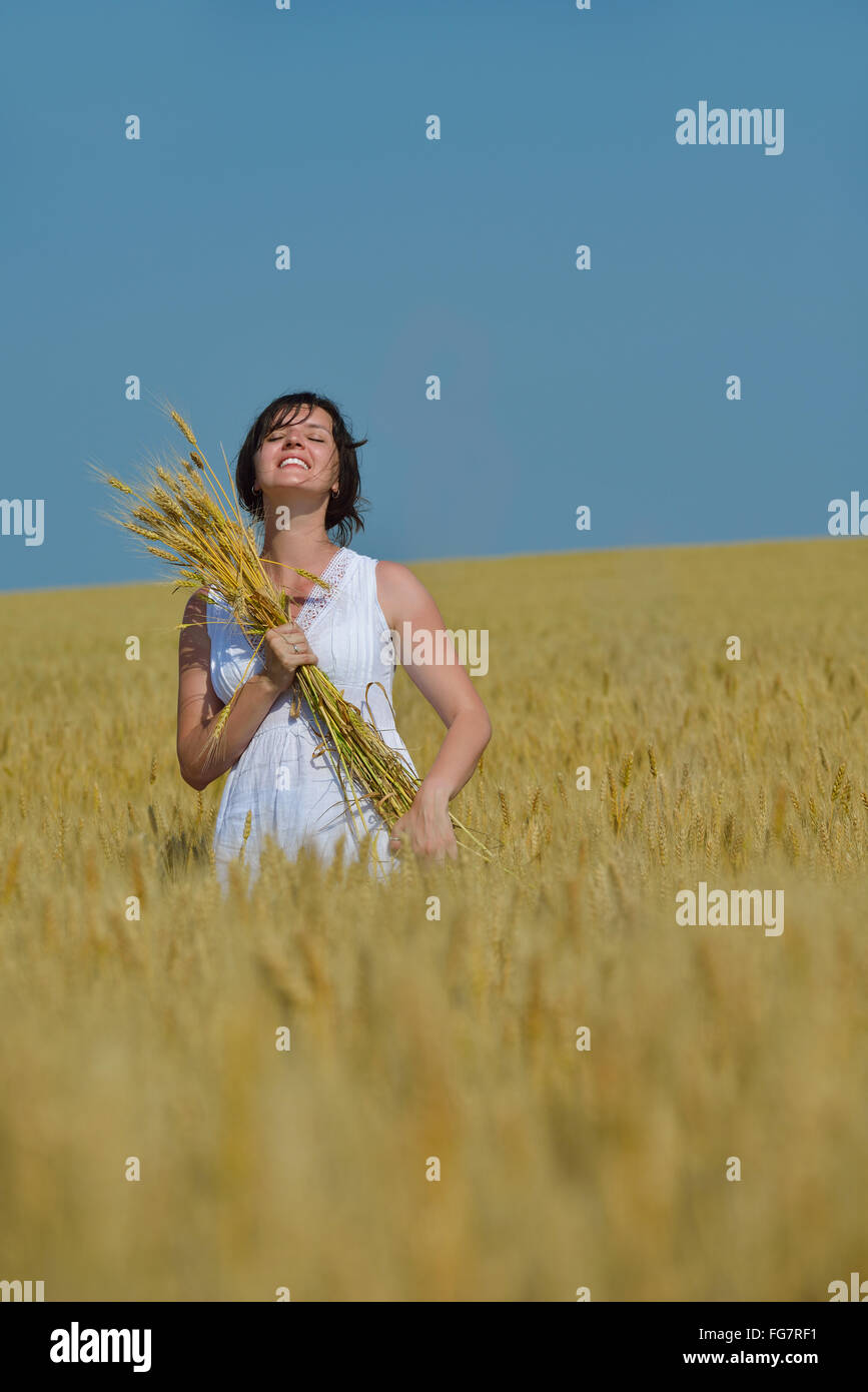 young woman in wheat field at summer Stock Photo - Alamy